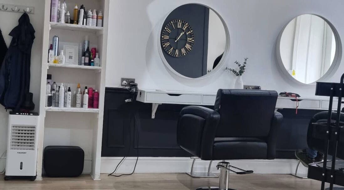 Modern salon interior at Becki Nettel Hair and Beauty, Burton upon Trent, England, GB with styling chairs and mirrors.