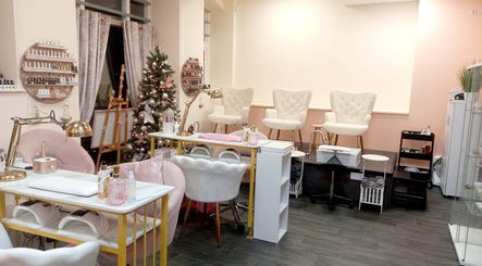 Chic interior of Myrto Zafeiropoulou spa in Birmingham, England, GB with white chairs and festive decor.