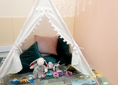Play tent with plush toys at Myrto Zafeiropoulou, Birmingham, England, GB, for a welcoming ambiance.