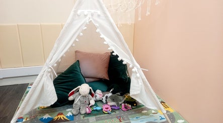 Play tent with plush toys at Myrto Zafeiropoulou, Birmingham, England, GB, for a welcoming ambiance.