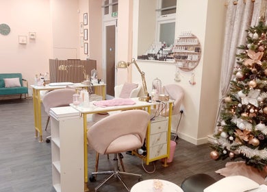 Elegant salon interior at Myrto Zafeiropoulou, Birmingham, England, GB featuring festive decor.