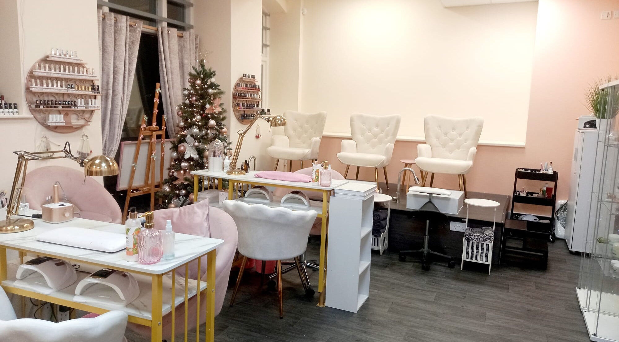 Chic interior of Nails and the City, Birmingham, England, GB, featuring plush chairs and manicure stations.