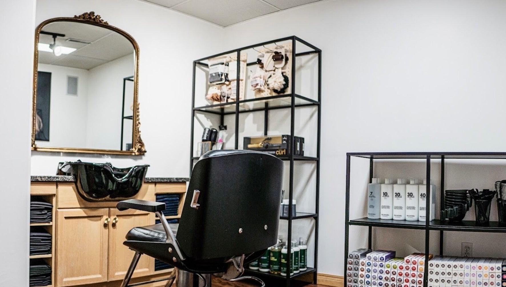Elegant hair styling station at Karen Giesbrecht Salon in Winkler, Manitoba, CA, featuring sleek design elements.