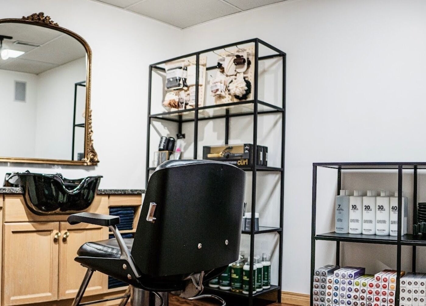 Elegant hair styling station at Karen Giesbrecht Salon in Winkler, Manitoba, CA, featuring sleek design elements.