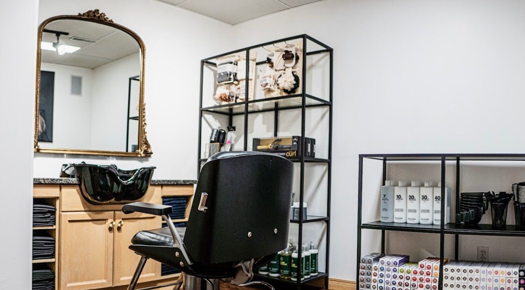Elegant hair styling station at Karen Giesbrecht Salon in Winkler, Manitoba, CA, featuring sleek design elements.