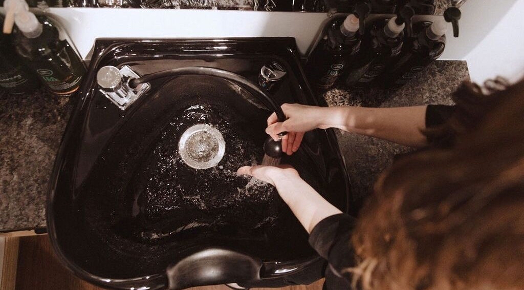 Hair washing station at Karen Giesbrecht Salon in Winkler, Manitoba, CA with luxurious products.
