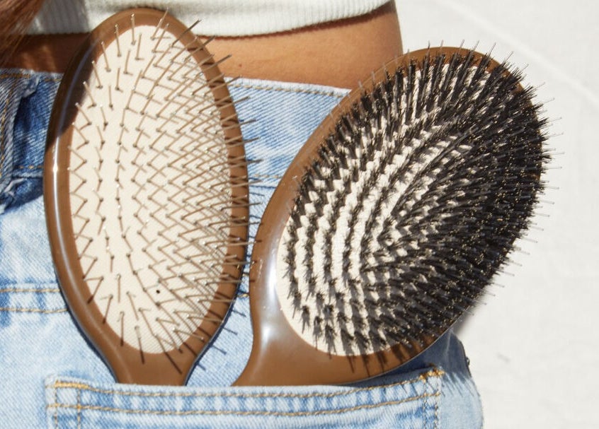 Hairbrushes in jeans pocket at Karen Giesbrecht Salon, Winkler, Manitoba, CA. Perfect styling tools for all hair types.