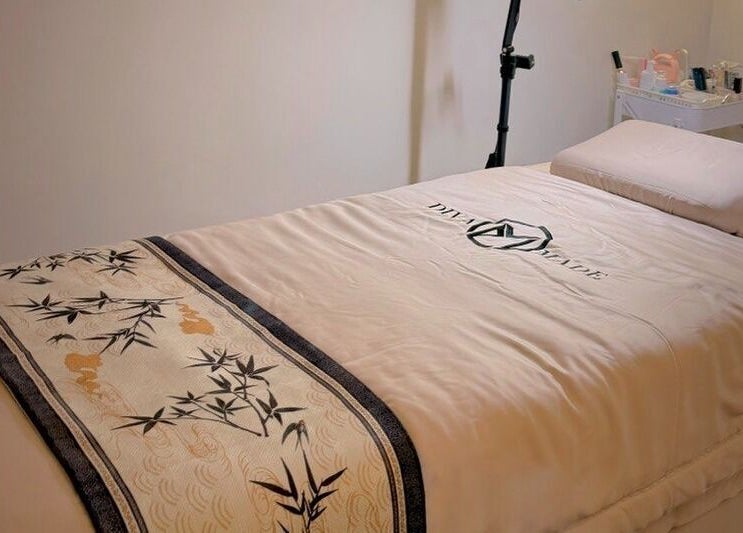 Spa bed at Diva Me At Thomson Rooftop, Singapore, SG, with elegant design for relaxation.