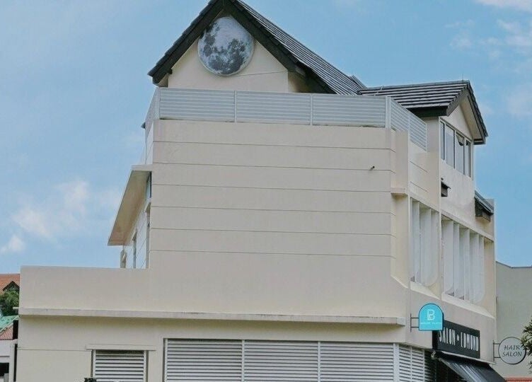 Exterior view of Diva Me At Thomson Rooftop in Singapore, SG showcasing elegant architecture against a blue sky.