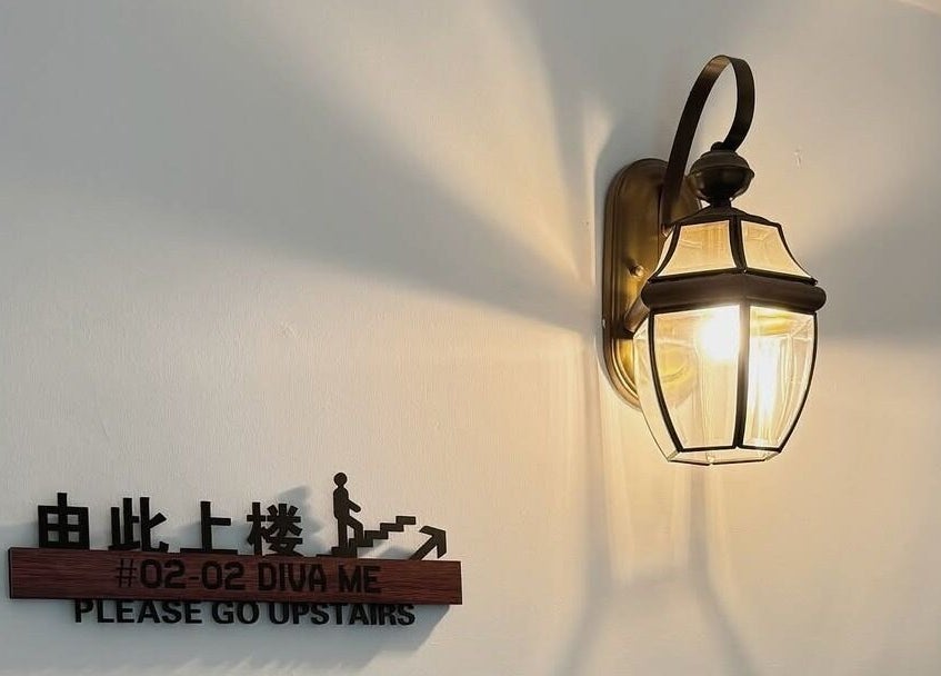 Elegant wall lamp with sign at Diva Me At Thomson Rooftop, Singapore, Singapore, SG.