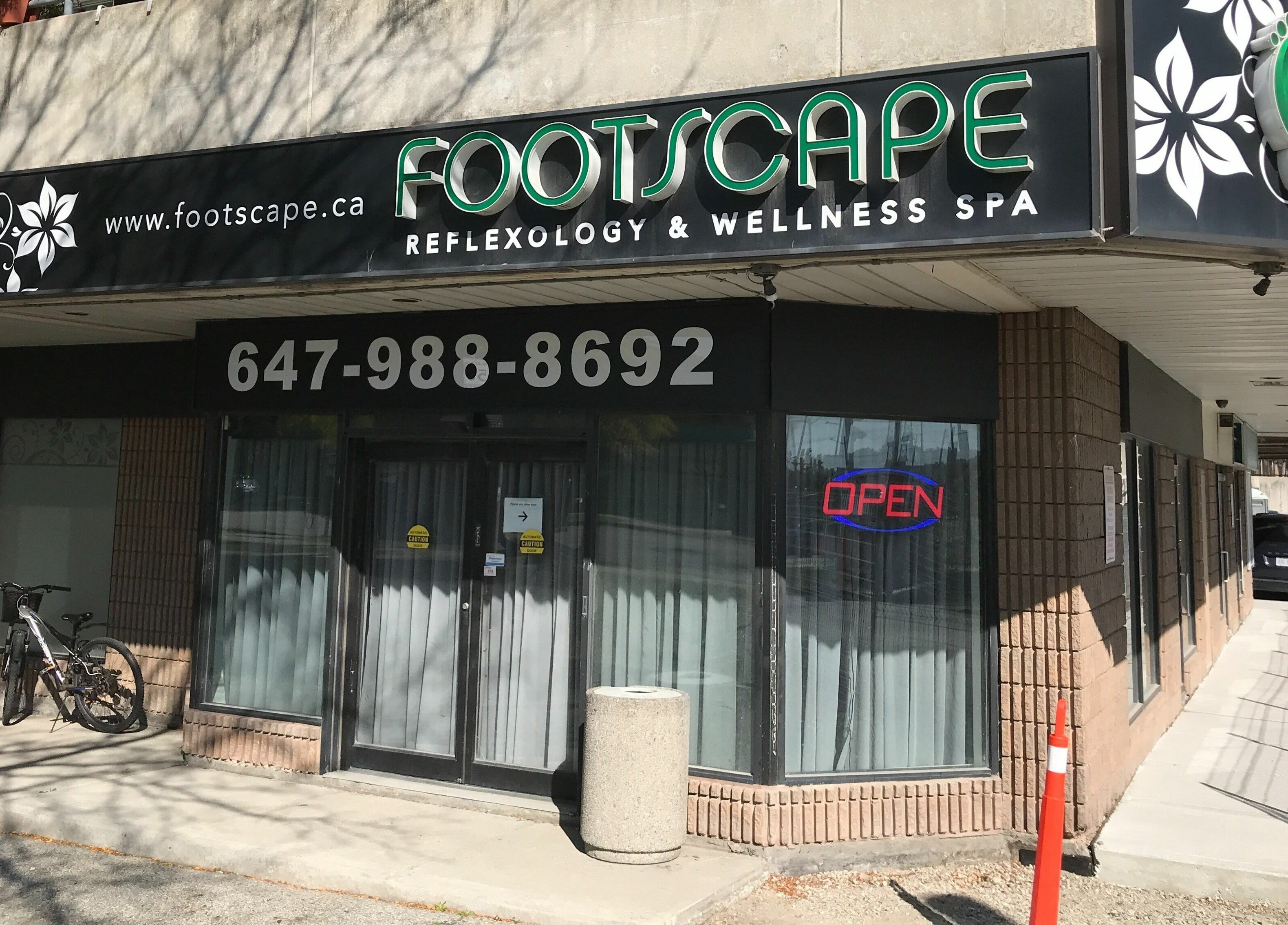 Exterior of Footscape Spa in Richmond Hill, Ontario, CA, showcasing inviting entrance and signage.