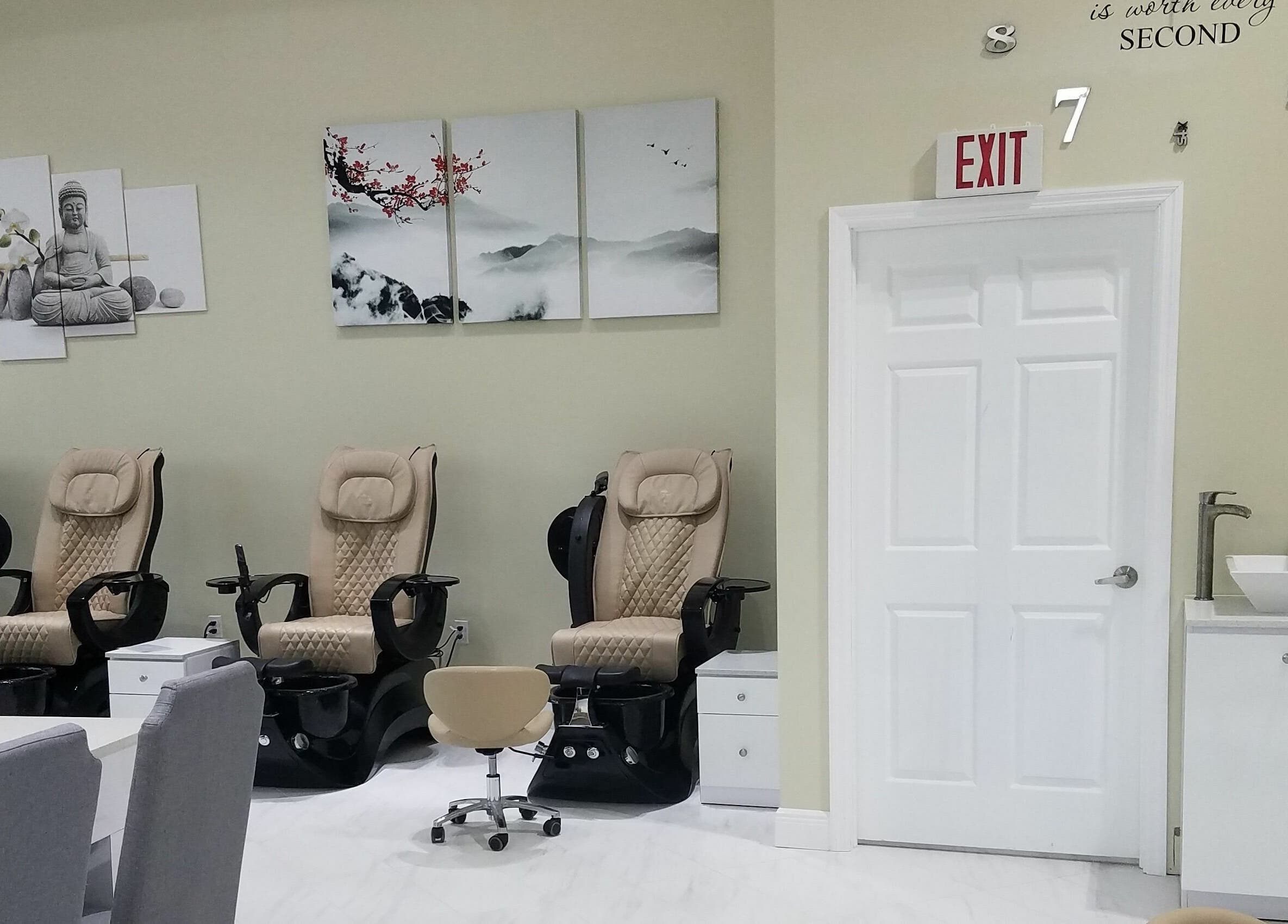 Relaxing pedicure chairs at The Nail Venue in Miami, Florida, US, with calming artwork and modern decor.