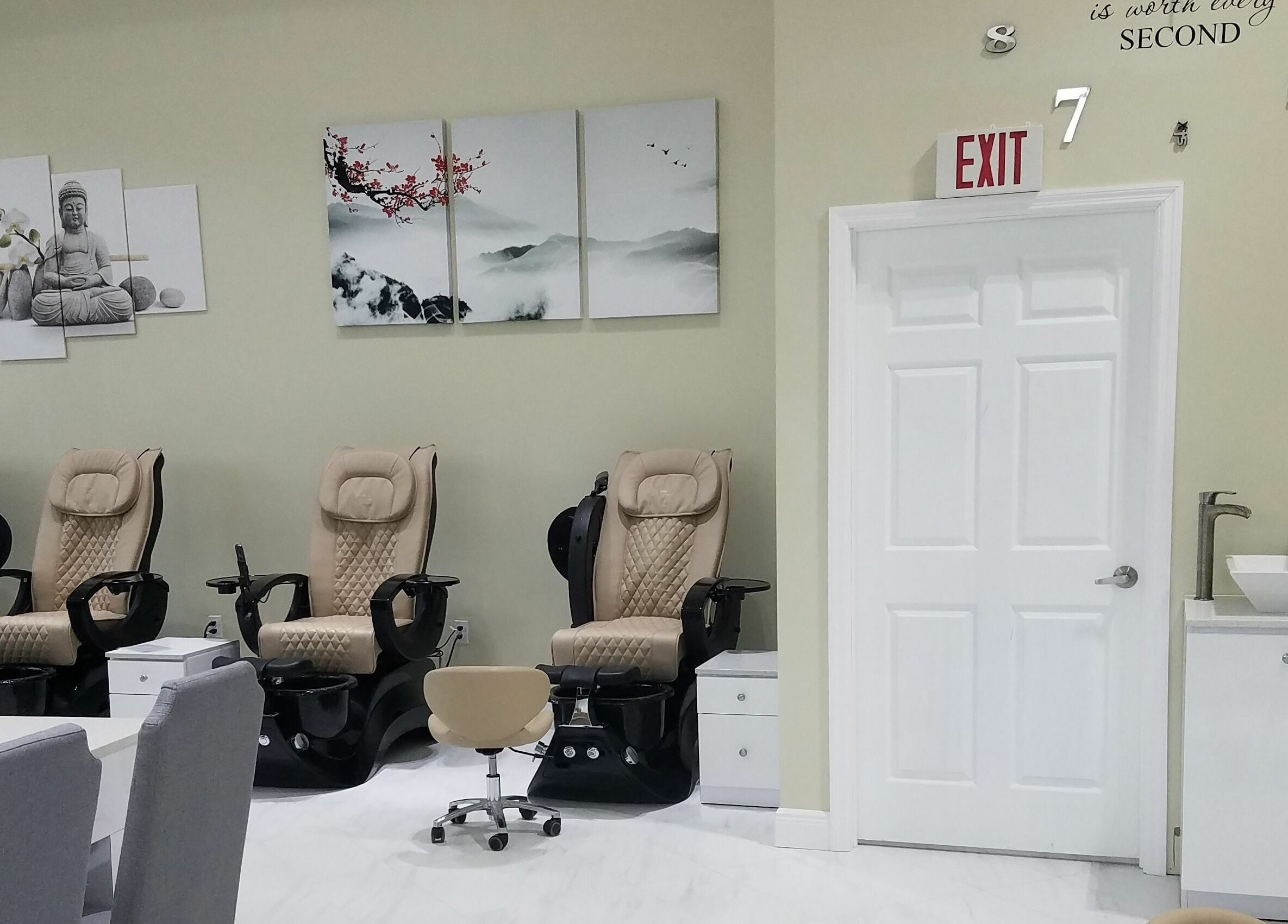 Relaxing pedicure chairs at The Nail Venue in Miami, Florida, US, with calming artwork and modern decor.
