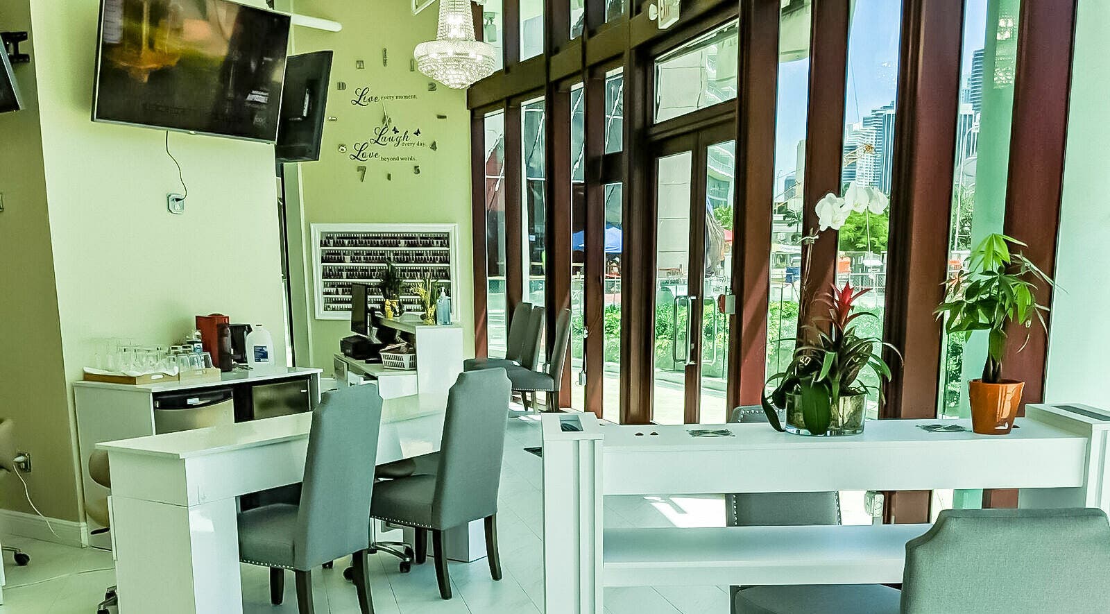 Interior view of The Nail Venue in Miami, Florida, US, showcasing elegant nail stations and vibrant decor.