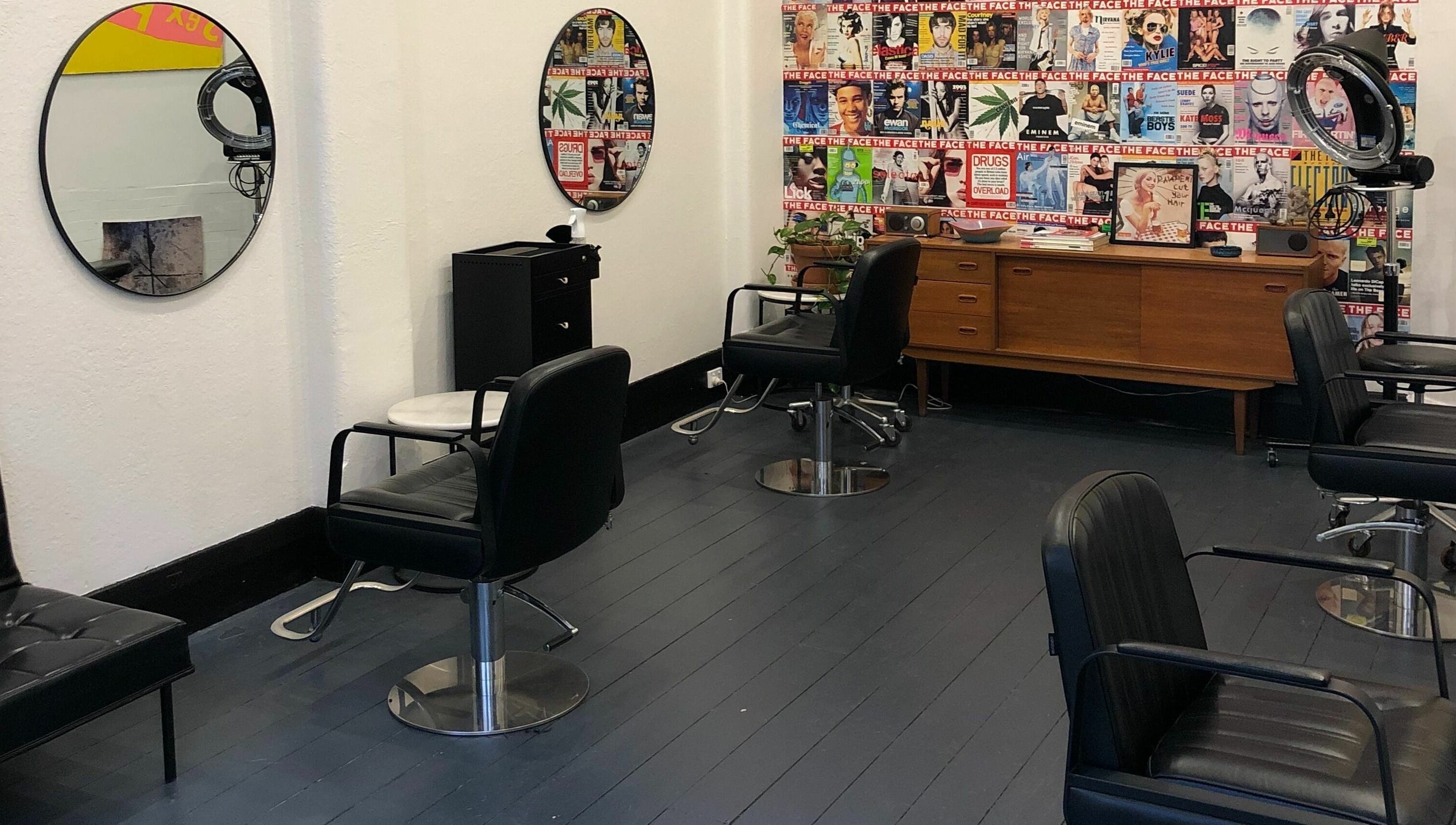Chic salon interior at Paradise Cutters, Melbourne, Victoria, AU with vintage decor and stylish seating.