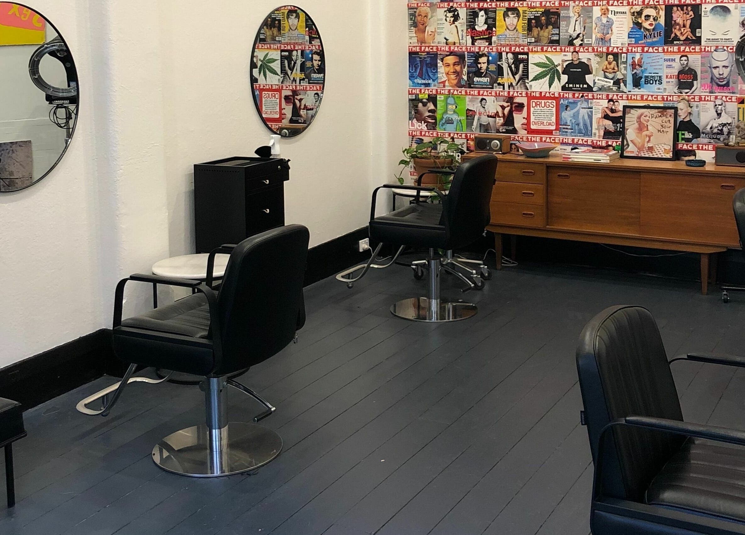 Chic salon interior at Paradise Cutters, Melbourne, Victoria, AU with vintage decor and stylish seating.