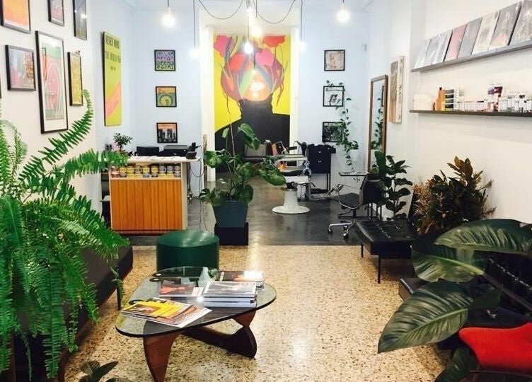 Stylish salon interior at Paradise Cutters in Melbourne, Victoria, AU featuring lush plants and modern decor.