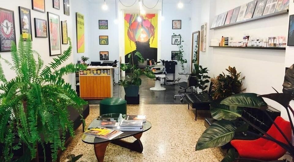 Stylish salon interior at Paradise Cutters in Melbourne, Victoria, AU featuring lush plants and modern decor.