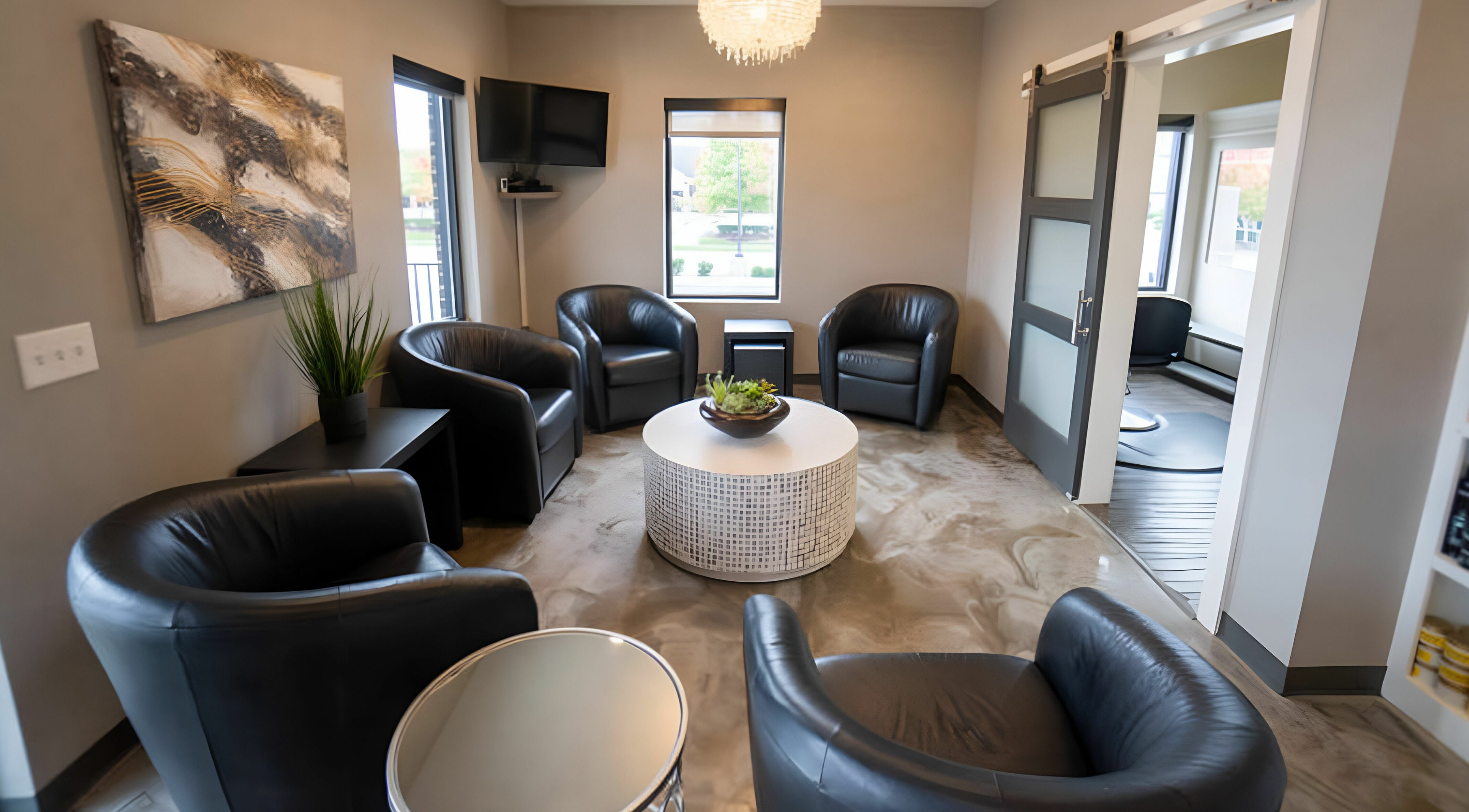 Elegant waiting area with plush chairs at Cheveux Salon, Hendersonville, Tennessee, US. Modern and inviting space.