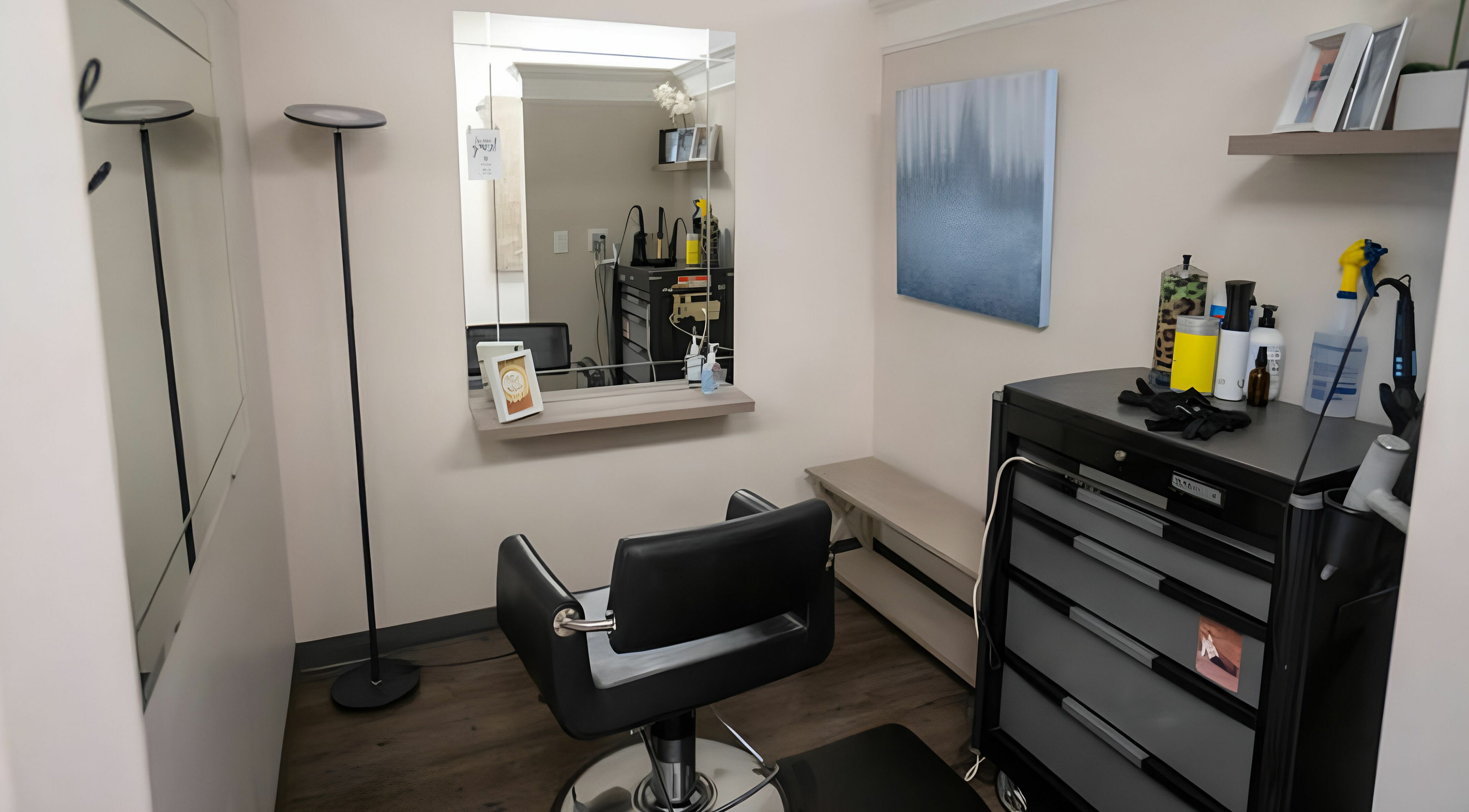 Modern styling station at Cheveux Salon, Hendersonville, Tennessee, US, featuring sleek decor and professional tools.