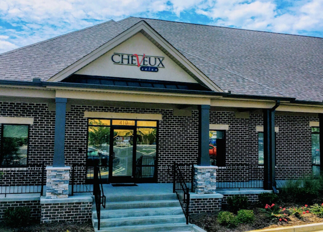 Front view of Cheveux Salon in Hendersonville, Tennessee featuring elegant brick architecture.