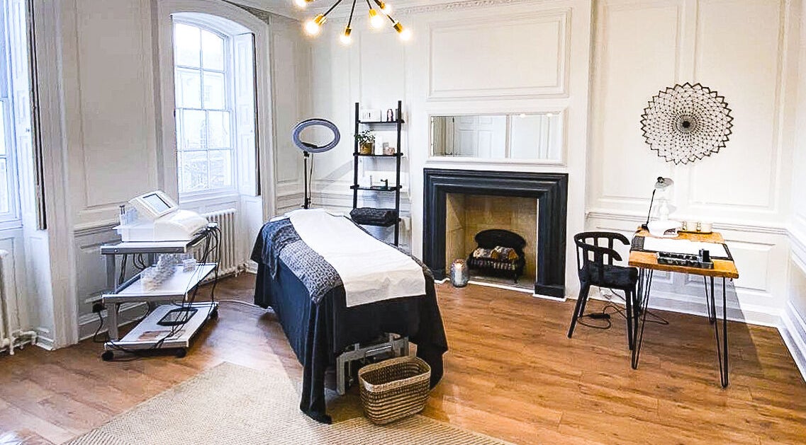 Elegant treatment room at Mooi Beauty, Market Harborough, England, GB with modern decor and relaxing ambiance.