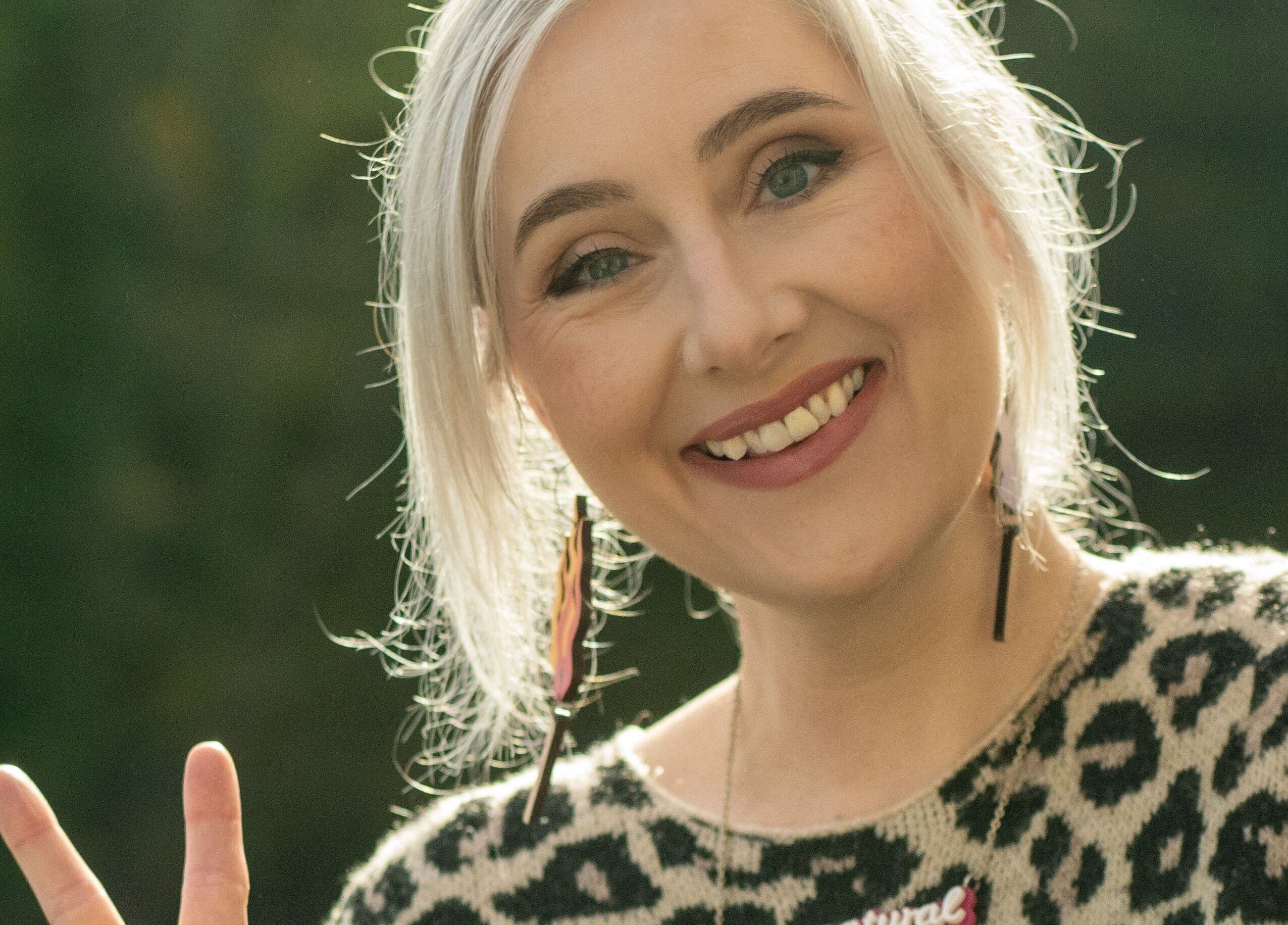 Woman with silver hair smiling at Offbeat Beauty Collective, Sheffield, England, GB.