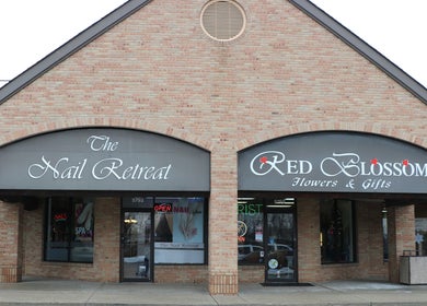 Street view of The Nail Retreat Dublin's brick exterior, located in Dublin, Ohio, US.