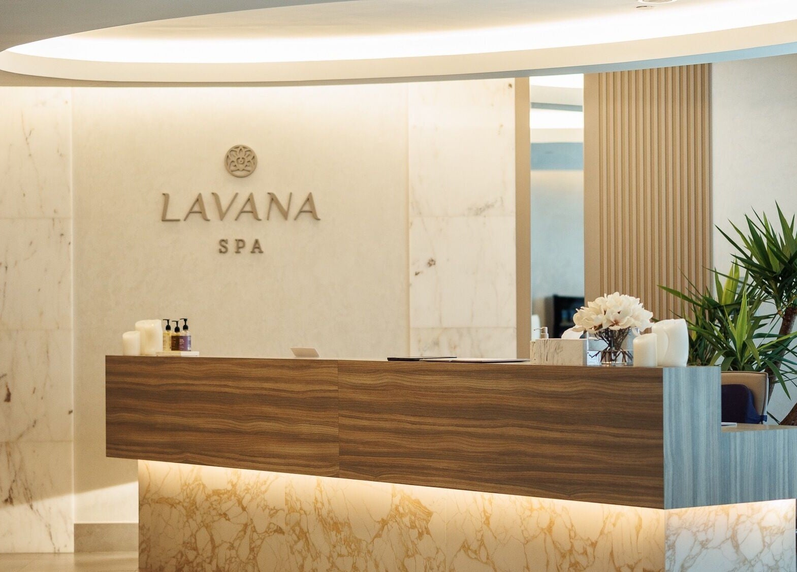 Entryway of Lavana Spa - DIFC in Dubai, Dubai, AE, featuring a modern reception with elegant decor.