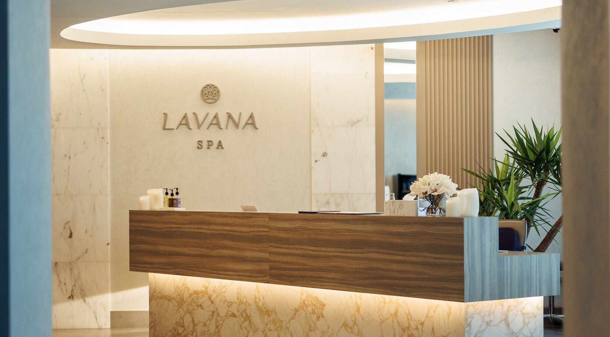Entryway of Lavana Spa - DIFC in Dubai, Dubai, AE, featuring a modern reception with elegant decor.