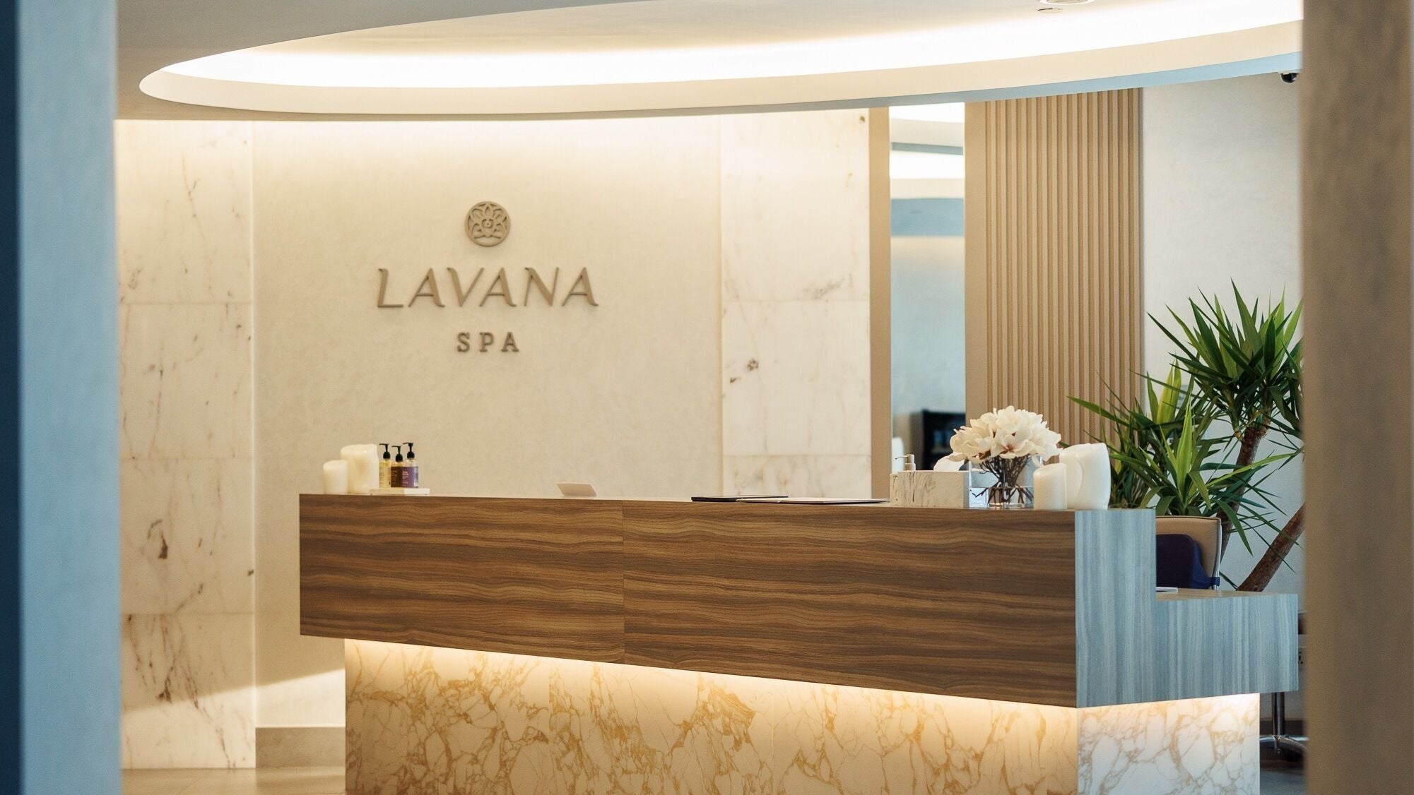 Entryway of Lavana Spa - DIFC in Dubai, Dubai, AE, featuring a modern reception with elegant decor.