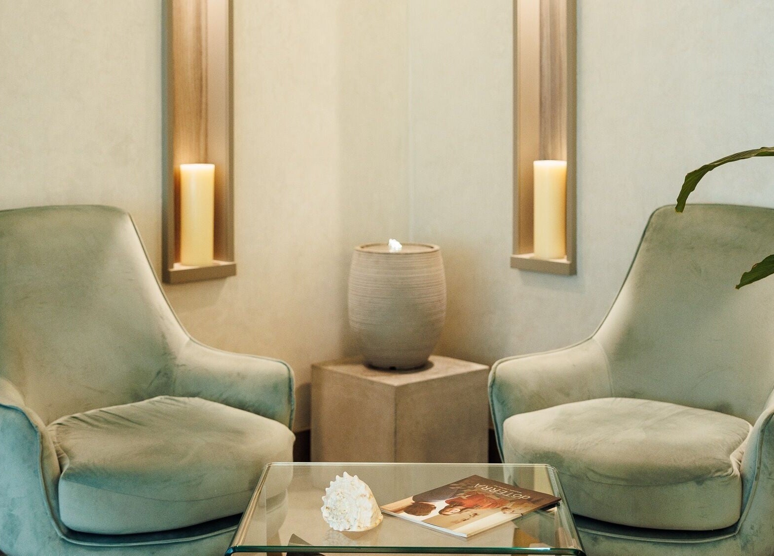 Relaxing lounge area at Lavana Spa - DIFC, Dubai, Dubai, AE with plush chairs and elegant decor.