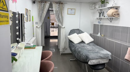 Luxurious treatment room at TL3 Hair and Beauty in London Colney, England, GB with cozy decor.