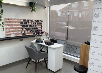 Elegant nail station at TL3 Hair and Beauty in London Colney, England, GB, showcasing sleek design and nail polish variety.