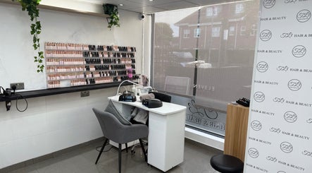 Elegant nail station at TL3 Hair and Beauty in London Colney, England, GB, showcasing sleek design and nail polish variety.