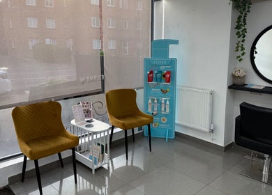Cozy waiting area at TL3 Hair and Beauty, London Colney, England, GB with stylish chairs and decor.