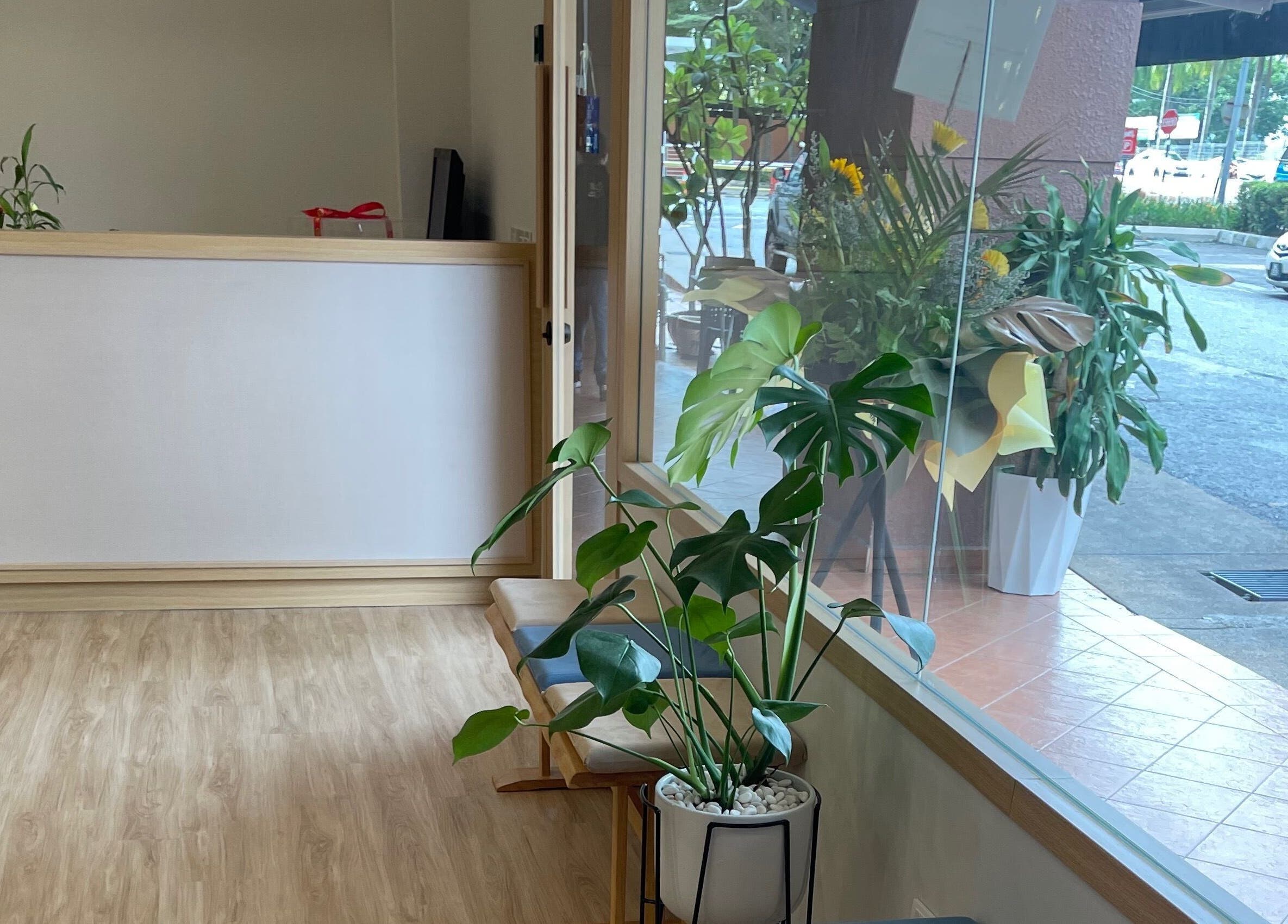 Bright, inviting entrance of Twt Hair Studio in Petaling Jaya, Selangor, MY with elegant decor and greenery.