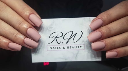Manicured hands with business card at Rebekah Nails and Make Up, Is-swieqi, MT.