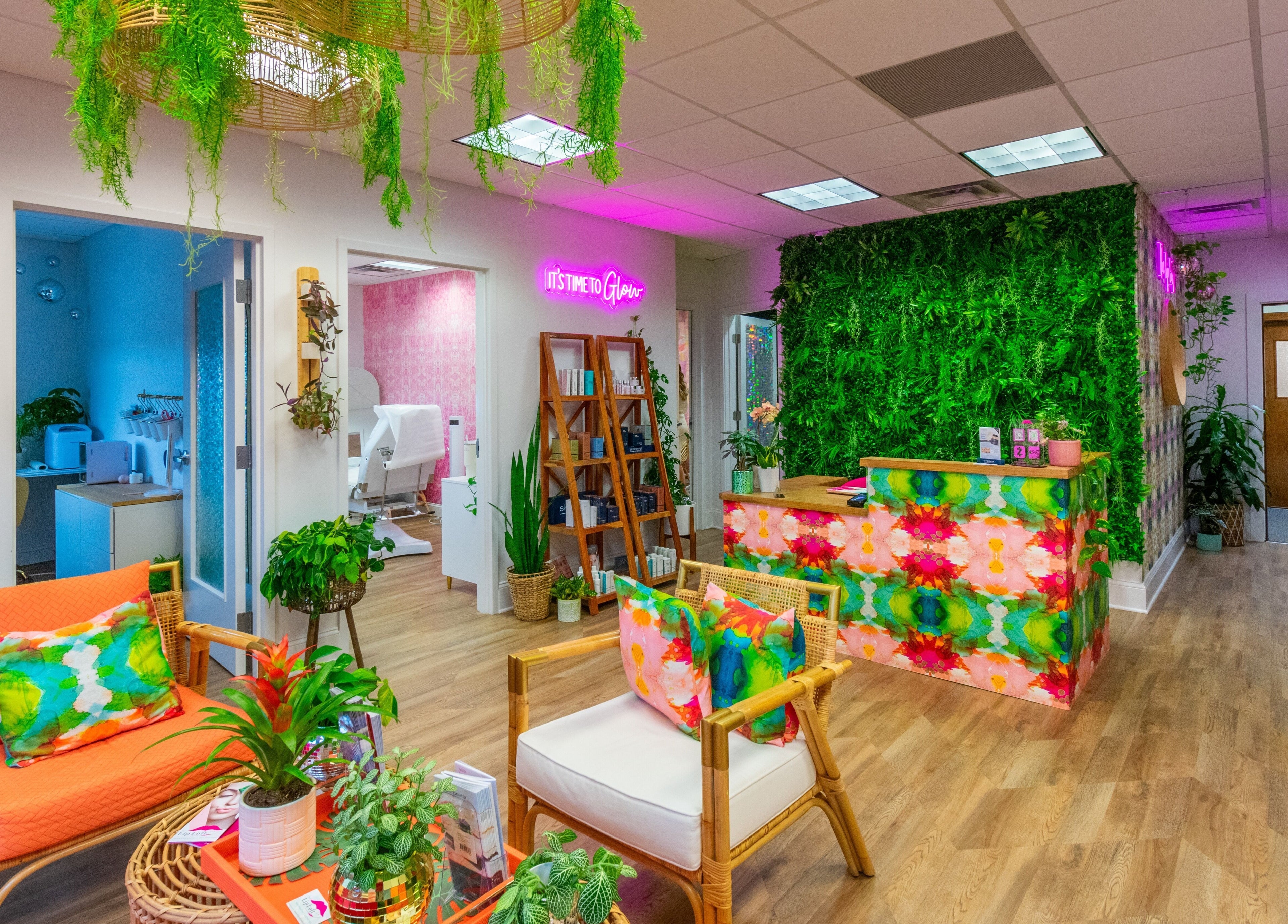 Bright and vibrant interior of The Lip Loft in Medford, Massachusetts, US with plants and colorful decor.