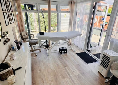 Bright and welcoming studio at Lush Lashes & Microblading, Ellesmere Port, England, GB with treatment table.