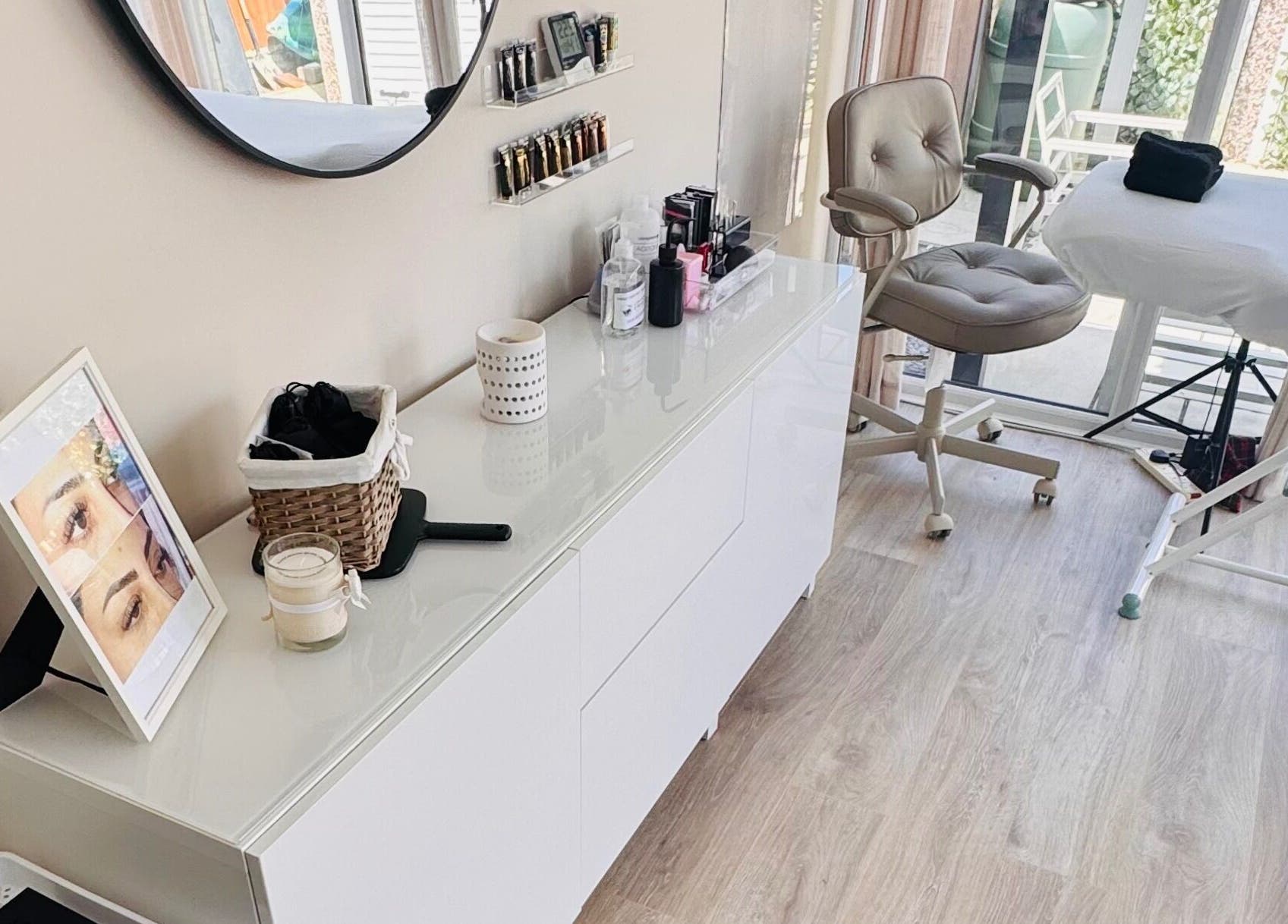 Peaceful treatment room at Lush Lashes & Microblading, Ellesmere Port, England, GB with beauty products.