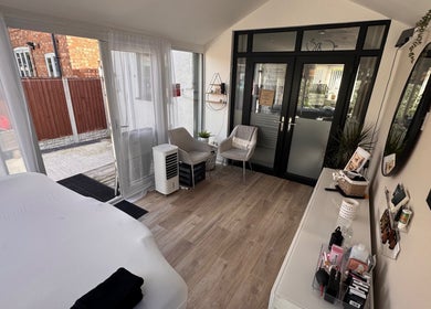 Bright treatment room at Lush Lashes & Microblading, Ellesmere Port, England showcasing a tranquil spa setting.