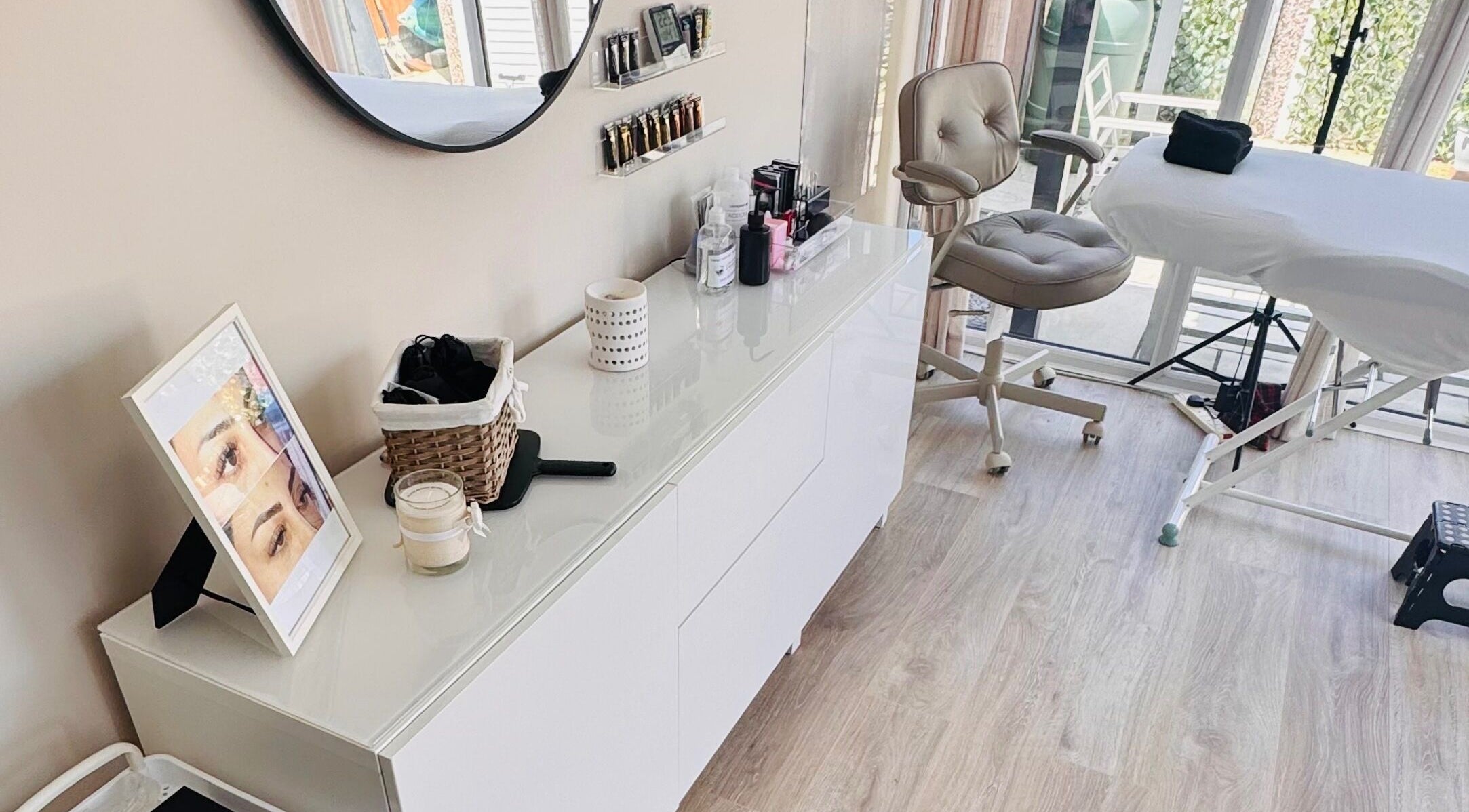 Treatment room at Lush Lashes & Microblading, Great Sutton, England, GB showcasing a modern, elegant setup.