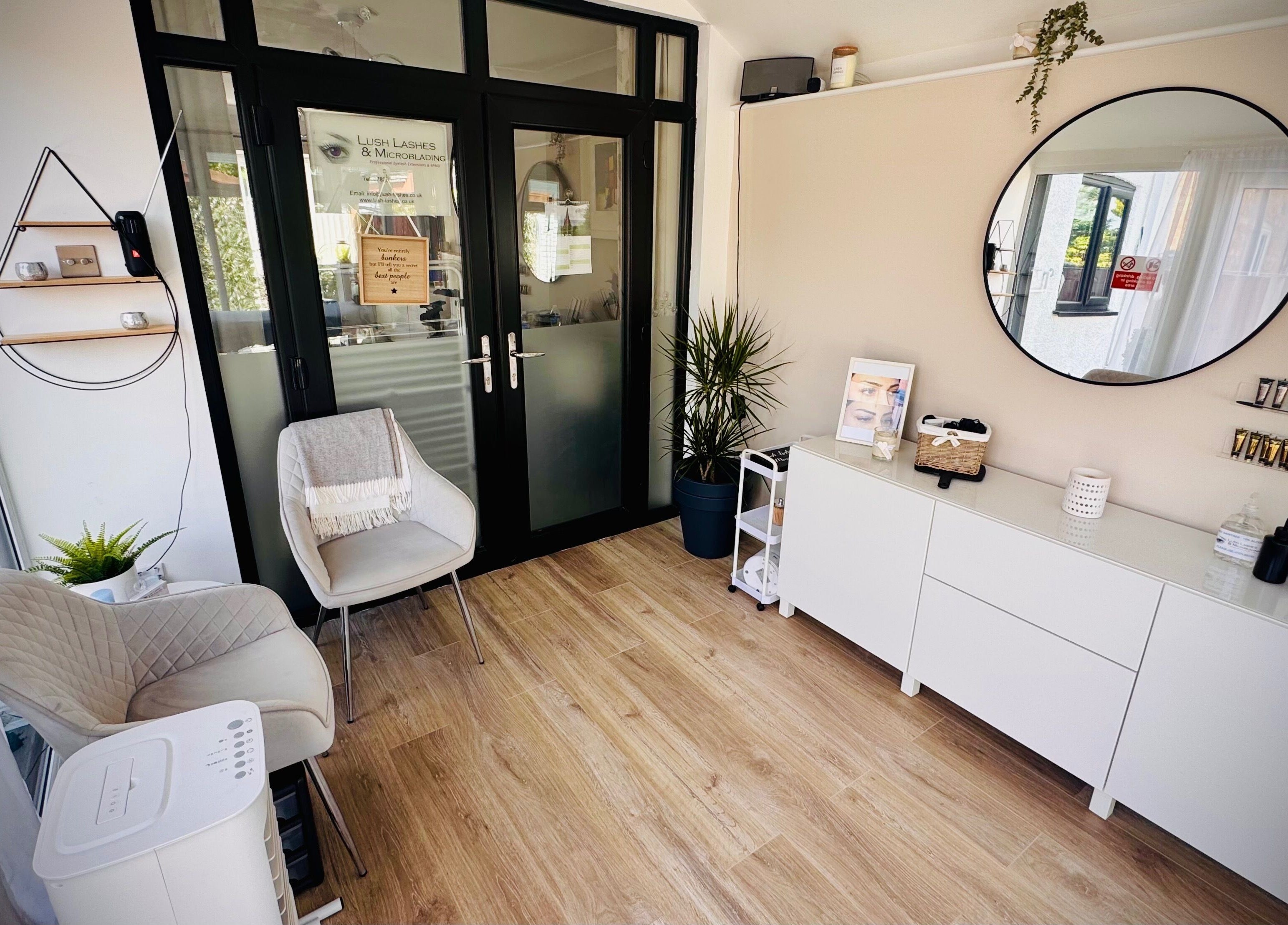 Stylish interior of Lush Lashes & Microblading, Great Sutton, England, GB, featuring modern decor and cozy seating.