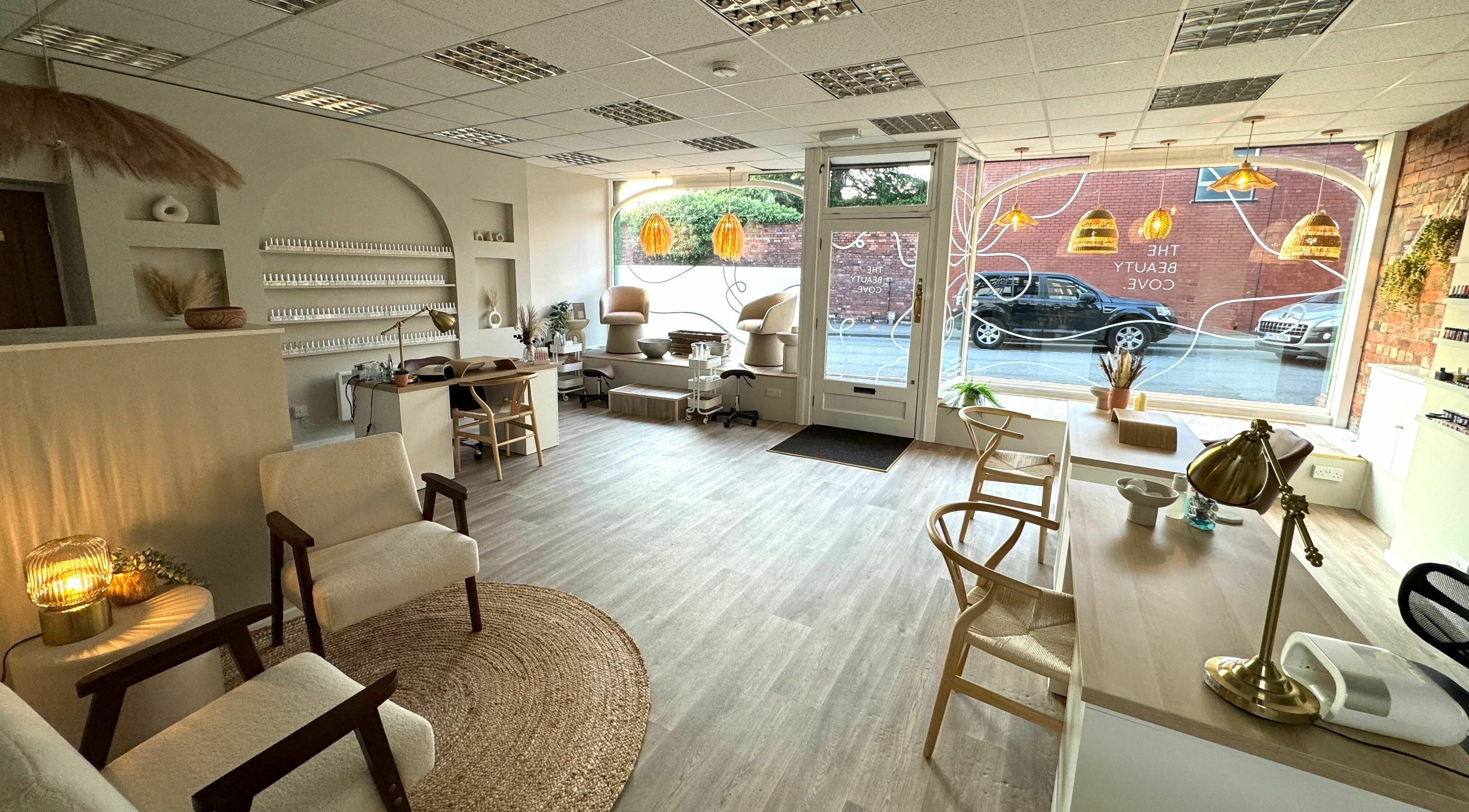 Chic and inviting interior of The Beauty Cove, Leek, England, GB with modern decor and cozy seating.