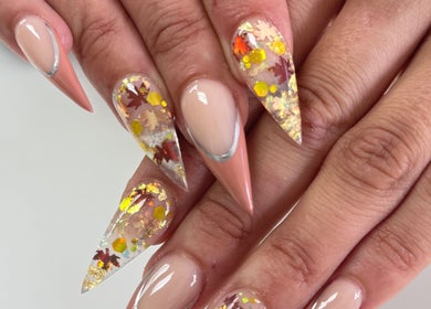 Elegant autumn-themed nail art at Nailistix, West Bloomfield Township, Michigan, US.