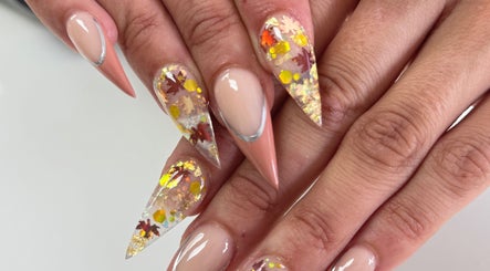 Elegant autumn-themed nail art at Nailistix, West Bloomfield Township, Michigan, US.