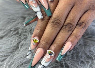 Exquisite nail design at Nailistix, West Bloomfield Township, Michigan, US featuring elegant gemstone accents.