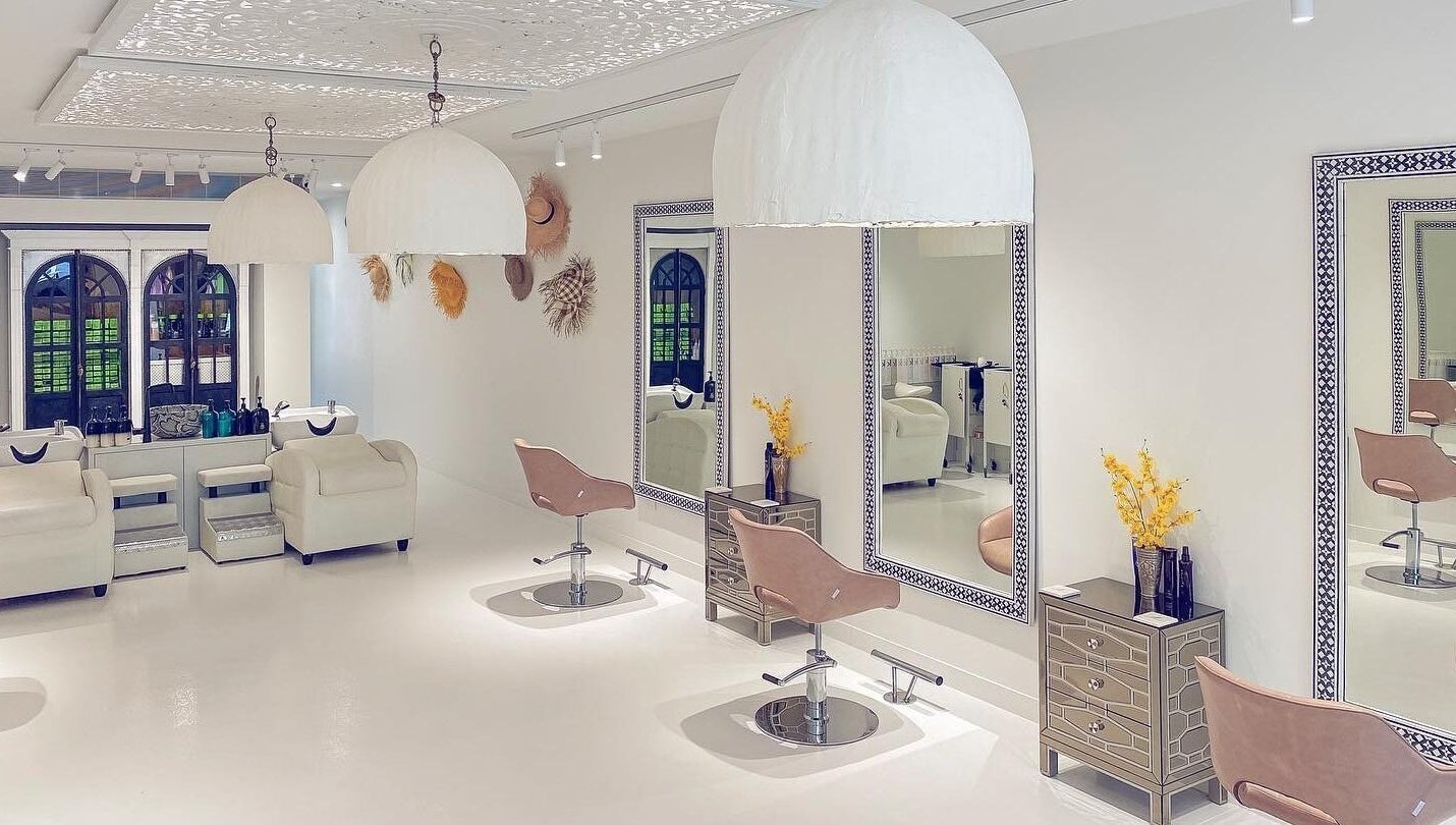 Elegant salon interior at Jacob Zinsli Salon, Surfers Paradise, Queensland, AU with chic chairs and mirrors.