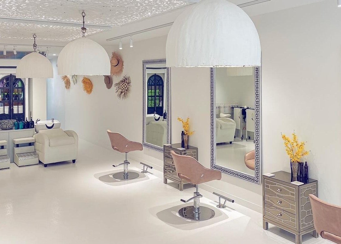 Elegant salon interior at Jacob Zinsli Salon, Surfers Paradise, Queensland, AU with chic chairs and mirrors.